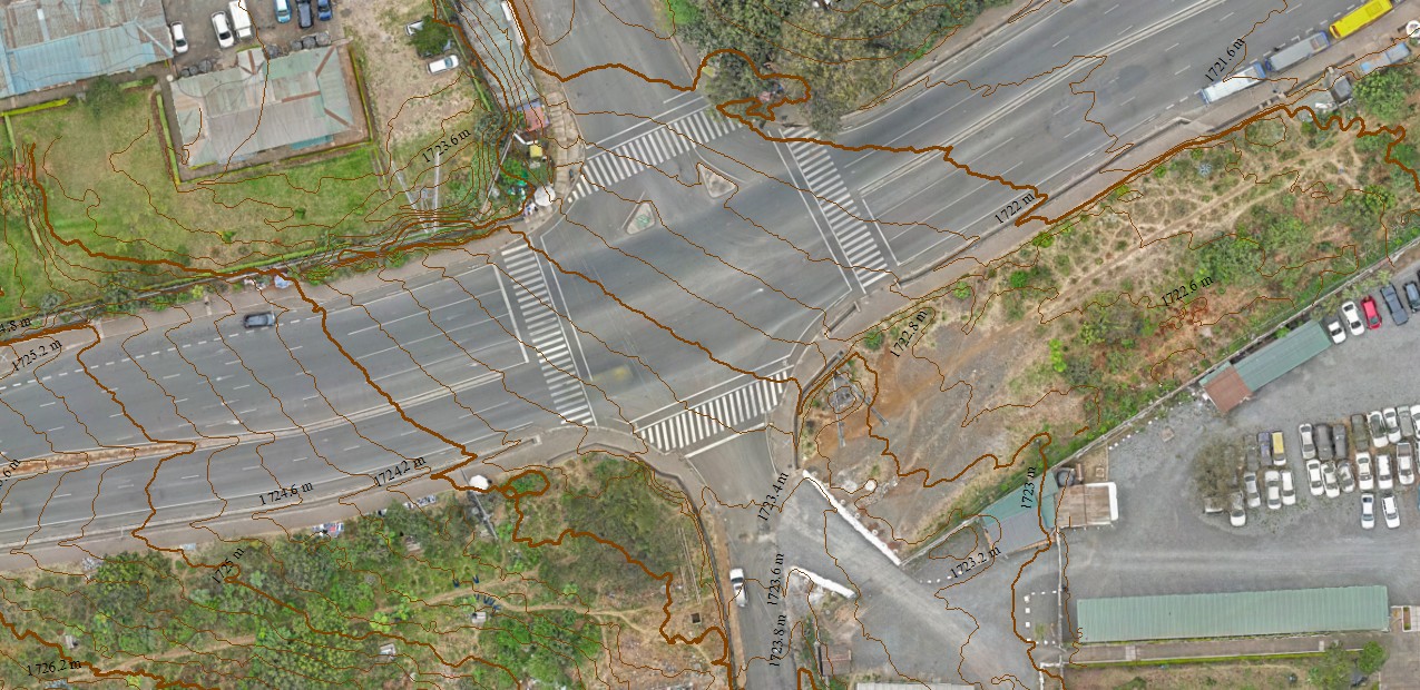 Processed aerial mapping of a road junction showing detailed road surface and surrounding features